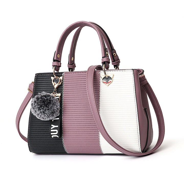 Colorblock handbag with pom-pom charm