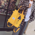 Canvas tote bag worn as a backpack