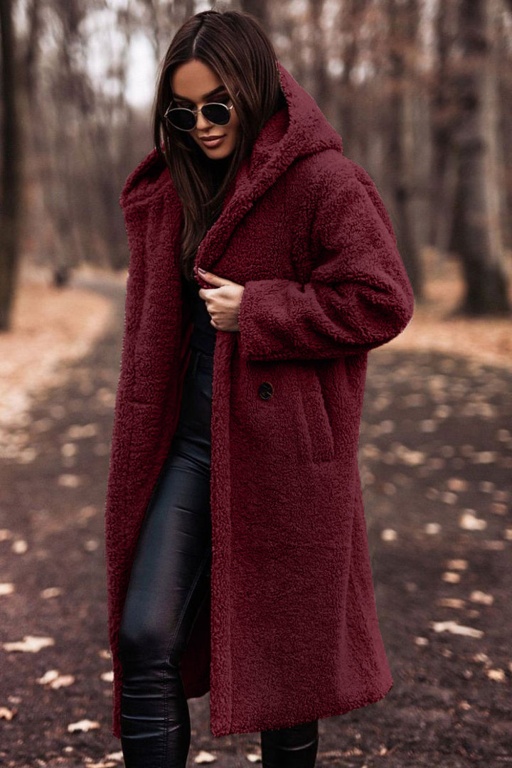 Woman in long hooded teddy coat
