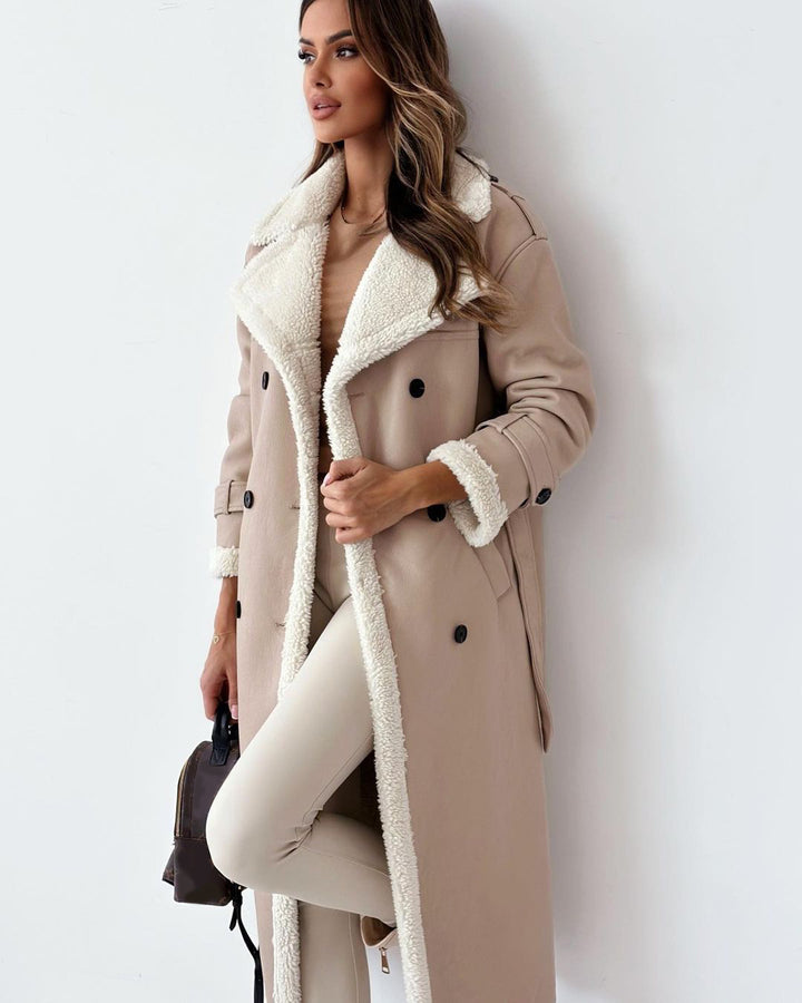 Woman in a belted faux shearling coat