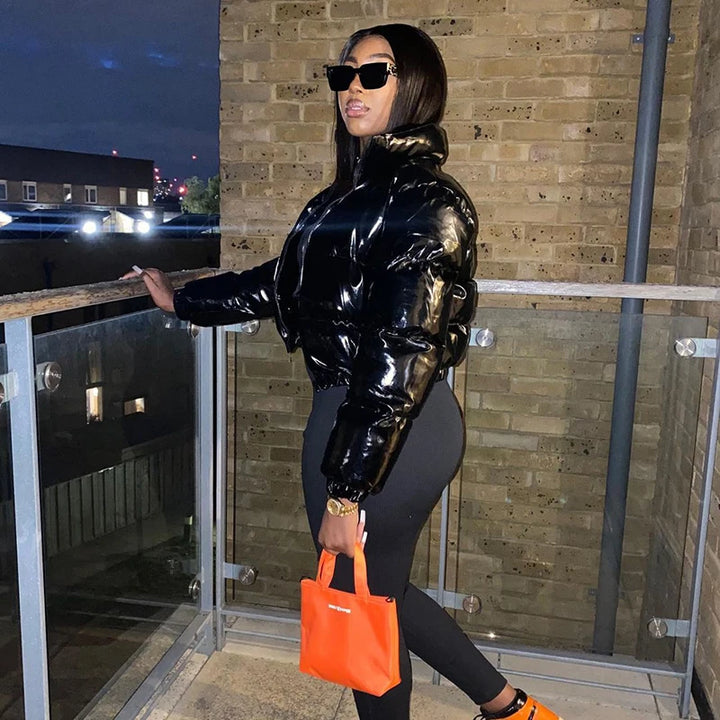 Woman in a glossy cropped puffer jacket