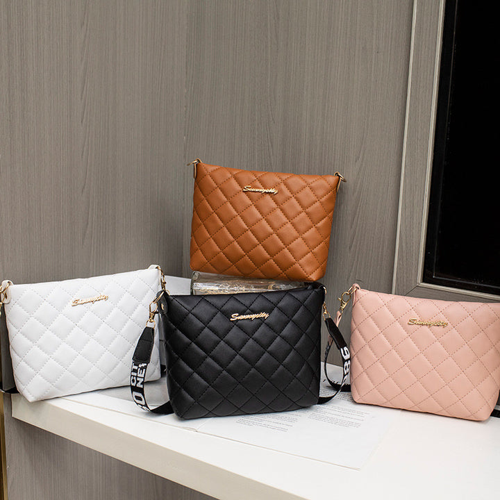 Black quilted crossbody bag with wide strap
