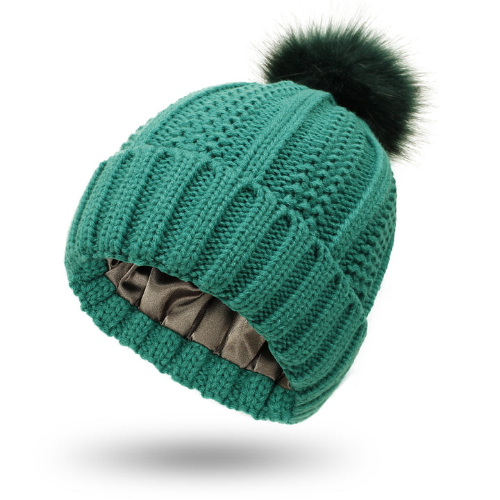 Knit beanie with faux fur pom pom