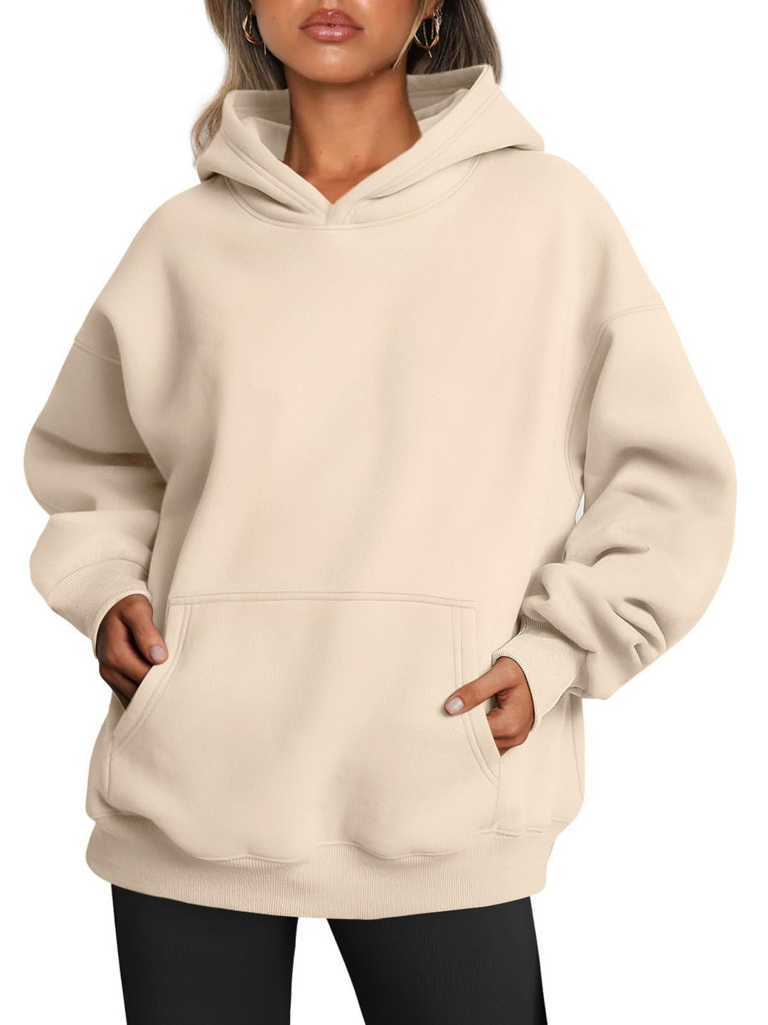 Woman wearing oversized fleece hoodie
