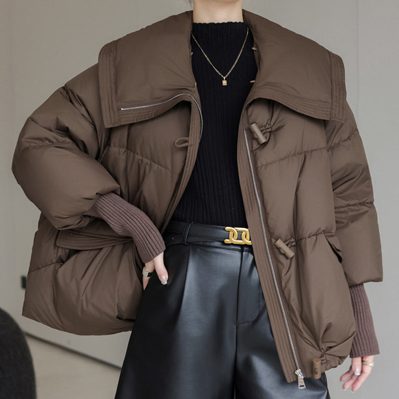 Woman in short puffer jacket with fur collar