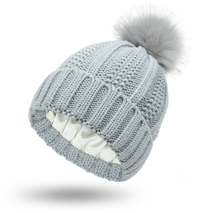 Knit beanie with faux fur pom pom