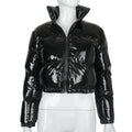 Woman in a glossy cropped puffer jacket