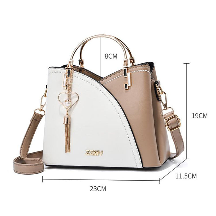 Color block handbag with heart tassel