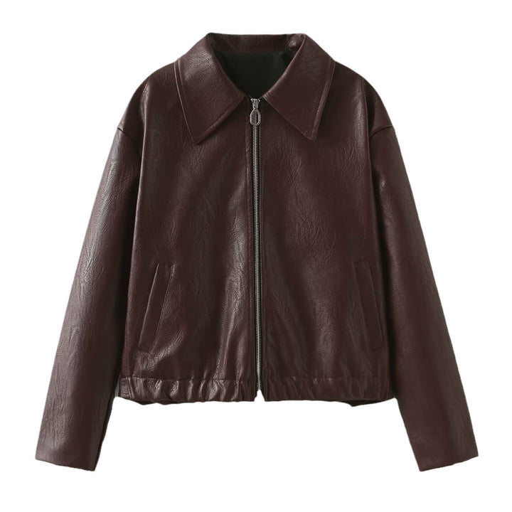 Woman in a cropped burgundy leather jacket