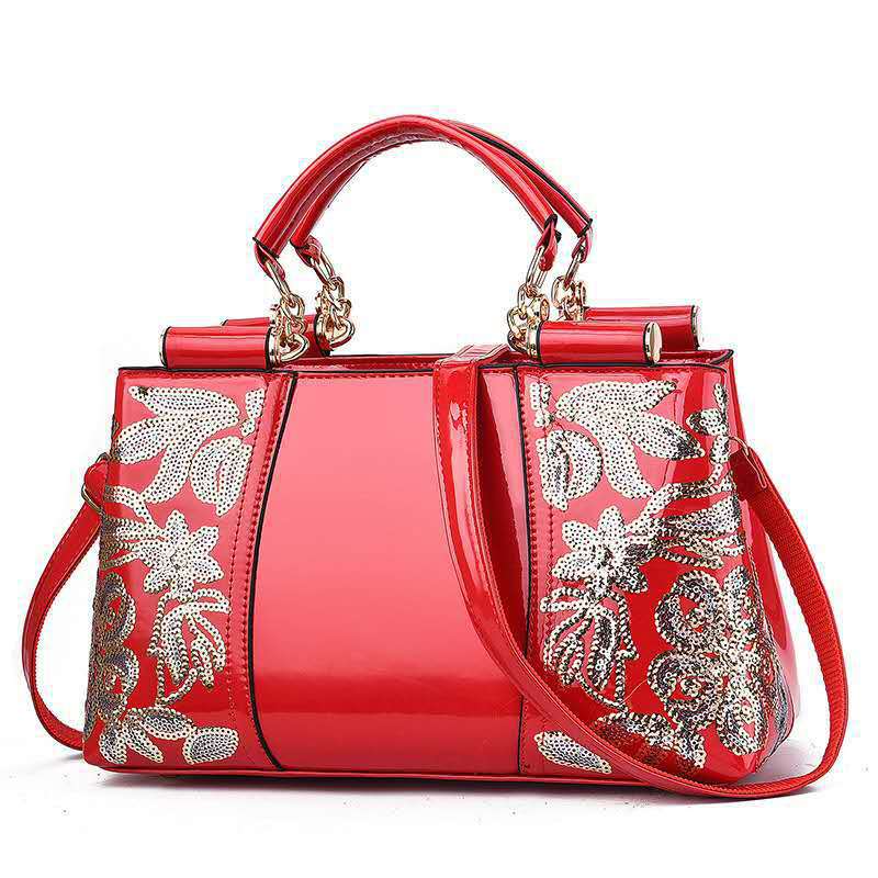 Sequin embroidered patent leather handbag