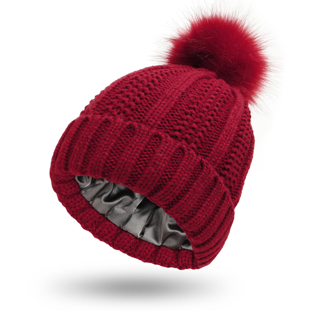 Knit beanie with faux fur pom pom