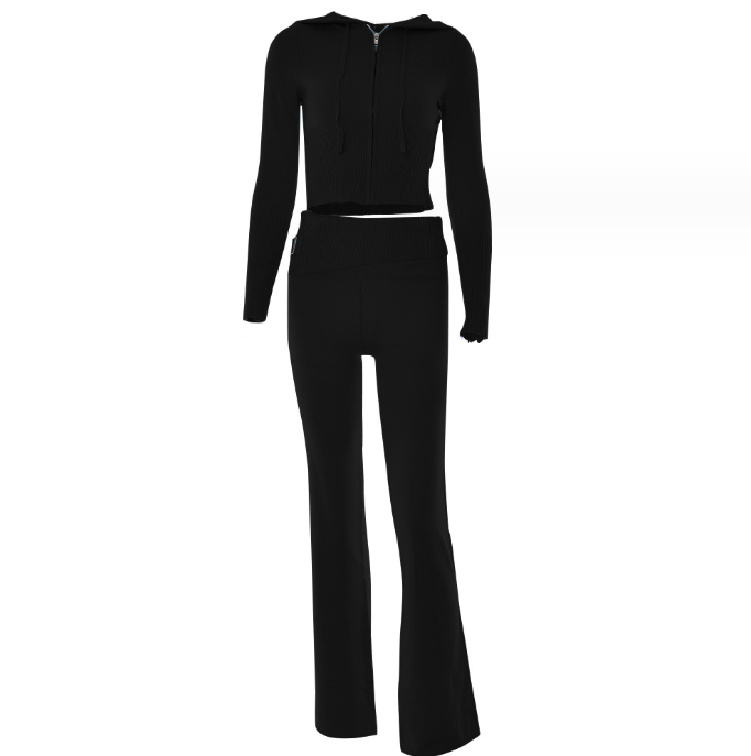Woman in ribbed knit hoodie and flare pants set