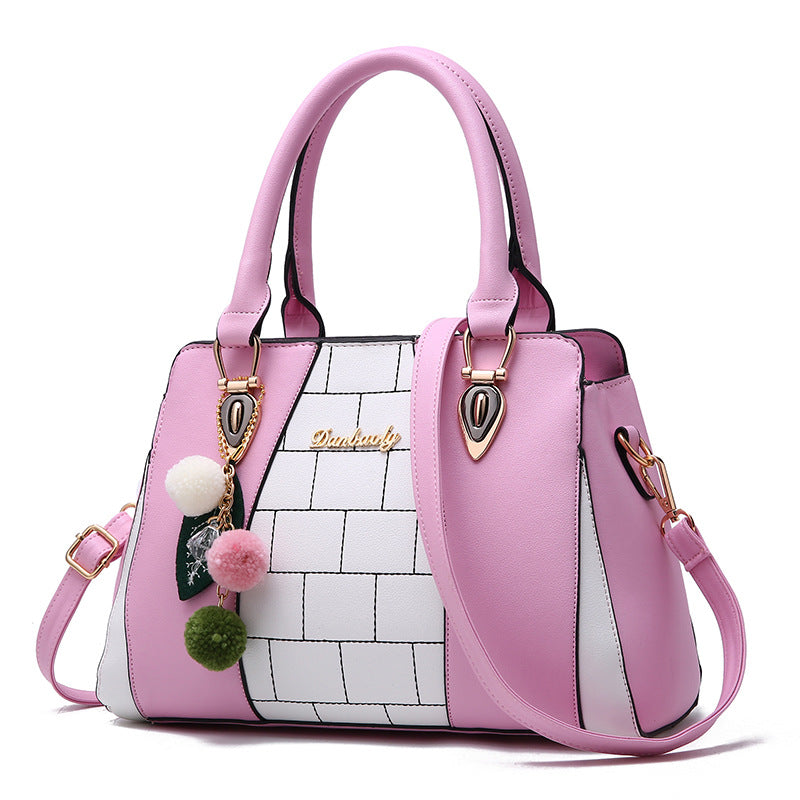 Two-tone handbag with pompom charm