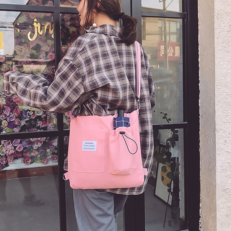 Canvas tote bag worn as a backpack