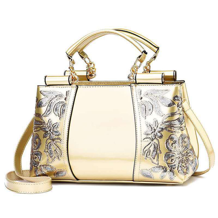 Sequin embroidered patent leather handbag