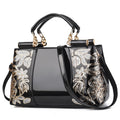Sequin embroidered patent leather handbag