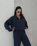 Woman in a half-zip fleece tracksuit